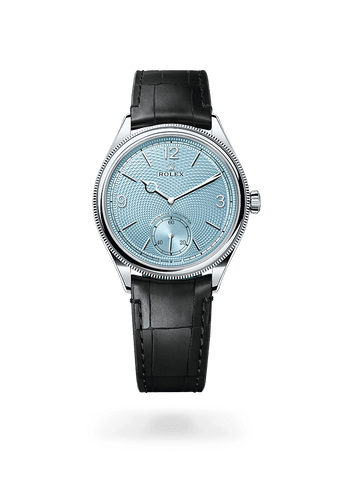 Montre Rolex 1908 dans 1908 avec un cadran Bleu glacier, décor grain de riz, lunette Bombée et cannelée et bracelet Bracelet en cuir.